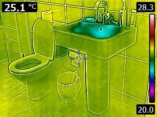 Thermal imaging inspection of sink area showing temperature differences to detect hidden leaks and heat loss.